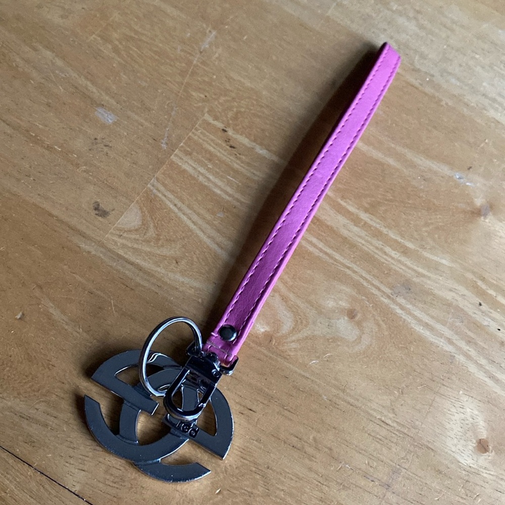Red by Marc ECKO brand bag charm, pink faux leather, silver color